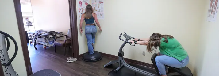 Chiropractor-College-Station-TX-Cole-Roemer-With-Physiotherapy-Rehab-Patients.webp physiotherapy back pain facts to know