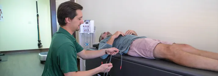 Chiropractor-College-Station-TX-Cole-Roemer-With-Sciatica-Patient.webp our chiropractic clinic helps sciatica pain