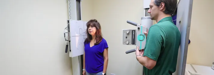 Chiropractor-College-Station-TX-Cole-Roemer-With-X-Ray-Patient.webp what can a chiropractor help with